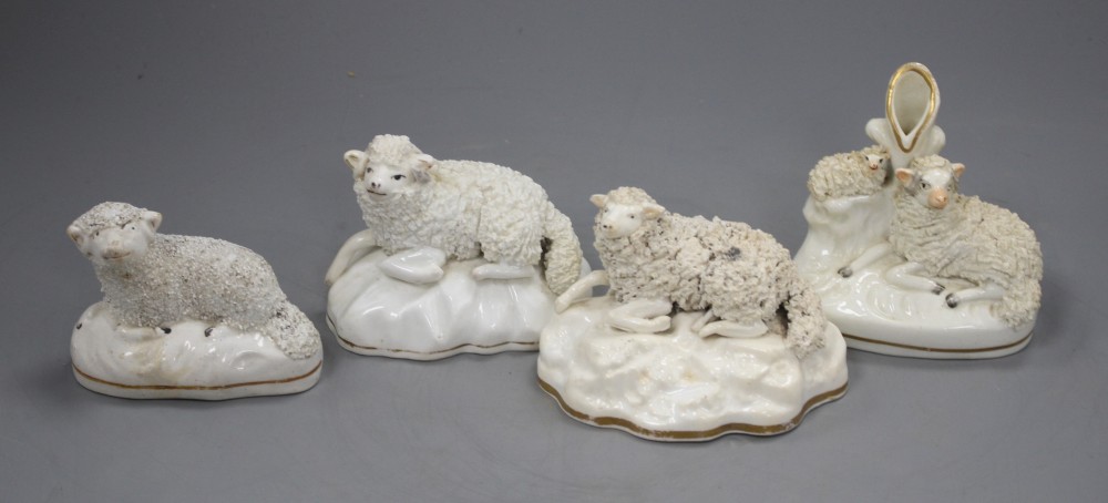 A Samuel Alcock porcelain figure of a recumbent ewe, an Alcock type ewe and two Staffordshire porcelain figures of sheep